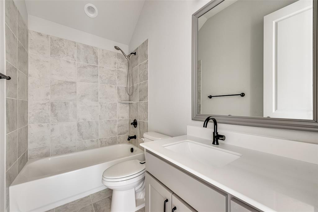 1905 Graham Way Mansfield, TX 76063 - Photo 12 of 20 a bathroom with a sink a toilet and a bathtub