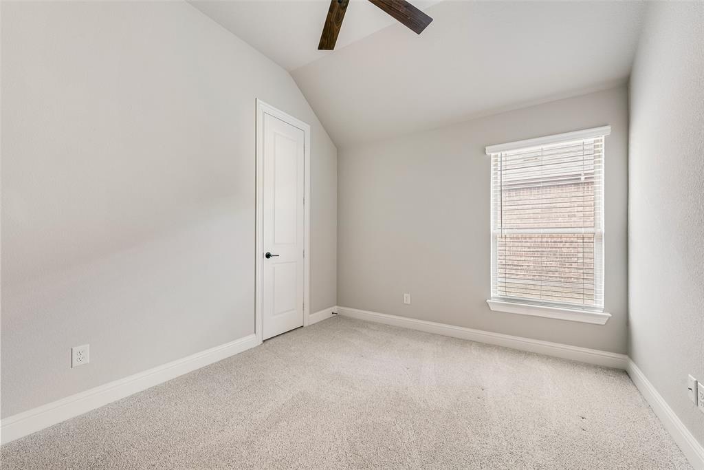 1905 Graham Way Mansfield, TX 76063 - Photo 13 of 20 an empty room with chandelier fan and windows