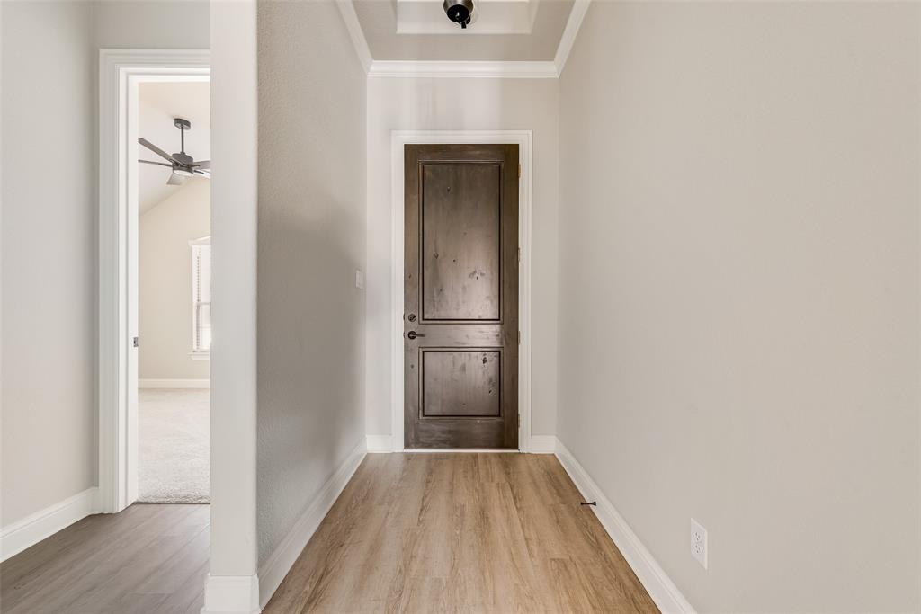 1905 Graham Way Mansfield, TX 76063 - Photo 3 of 20 a view of a hallway with wooden floor and a bathroom
