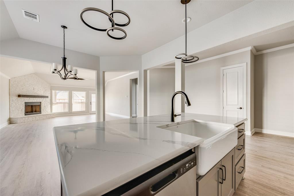 1905 Graham Way Mansfield, TX 76063 - Photo 10 of 20 a view of a kitchen with a sink and chandelier
