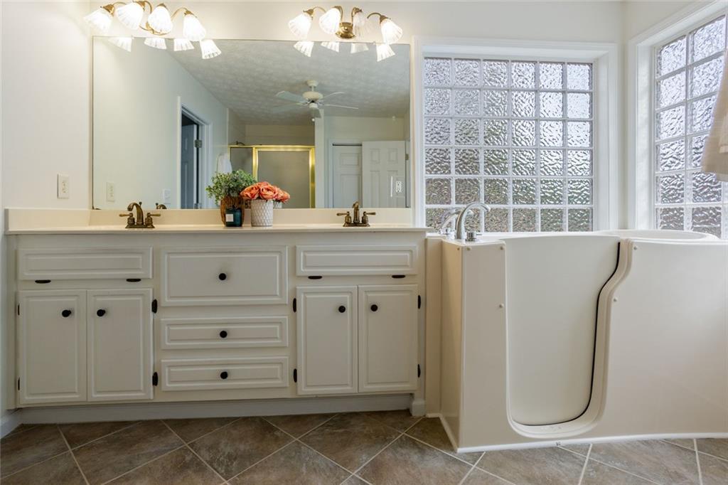 244 Kerry Drive Jasper, GA 30143 - Photo 12 of 24 a bathroom with a sink a vanity and a mirror