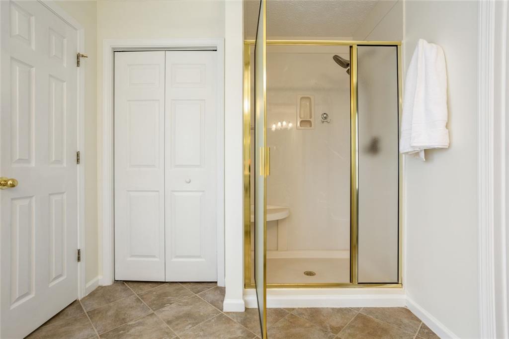 244 Kerry Drive Jasper, GA 30143 - Photo 13 of 24 a bathroom with a glass shower door