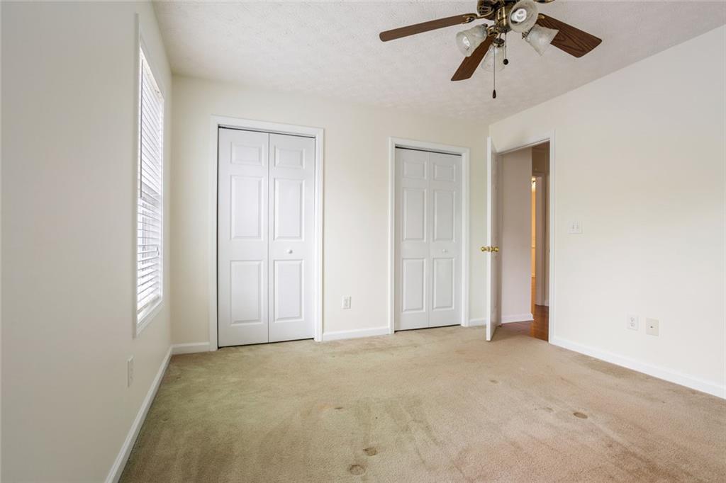 244 Kerry Drive Jasper, GA 30143 - Photo 18 of 24 an empty room with a empty space and a ceiling fan