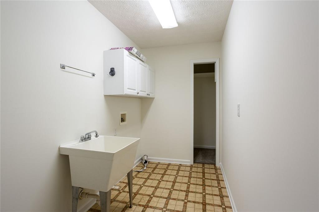 244 Kerry Drive Jasper, GA 30143 - Photo 19 of 24 a bathroom with a sink and mirror