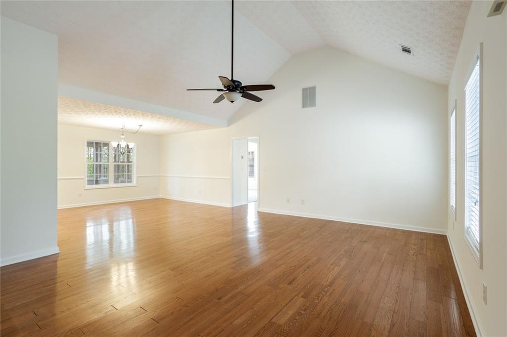 244 Kerry Drive Jasper, GA 30143 - Photo 5 of 24 a view of an empty room with wooden floor and a window