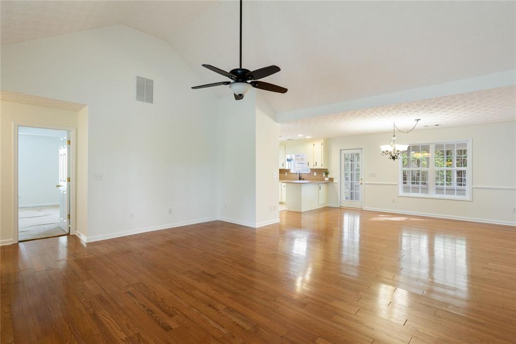 244 Kerry Drive Jasper, GA 30143 - Photo 7 of 24 a view of an empty room with wooden floor and a window