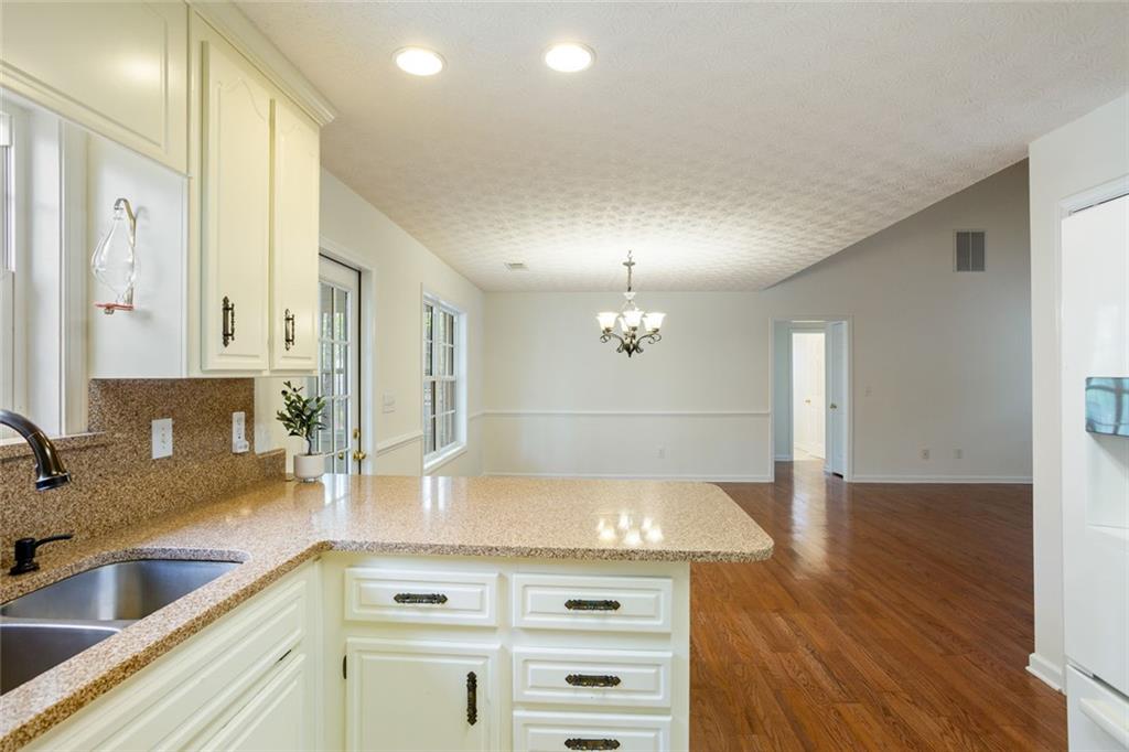 244 Kerry Drive Jasper, GA 30143 - Photo 9 of 24 a view of a kitchen counter space and wooden floor