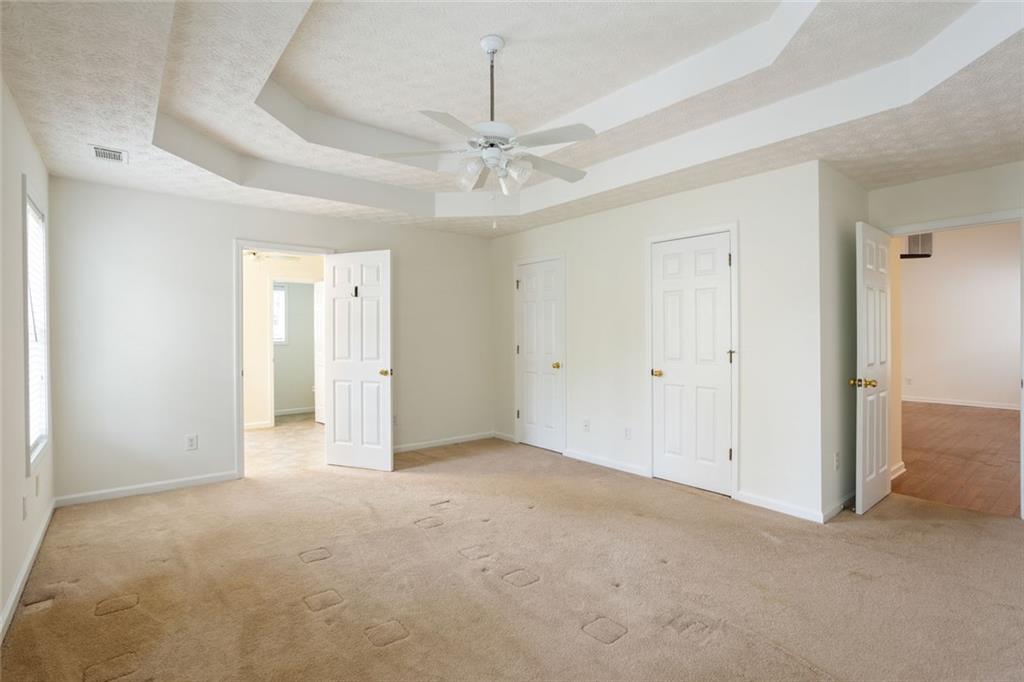 244 Kerry Drive Jasper, GA 30143 - Photo 10 of 24 an empty room with fan and entrance
