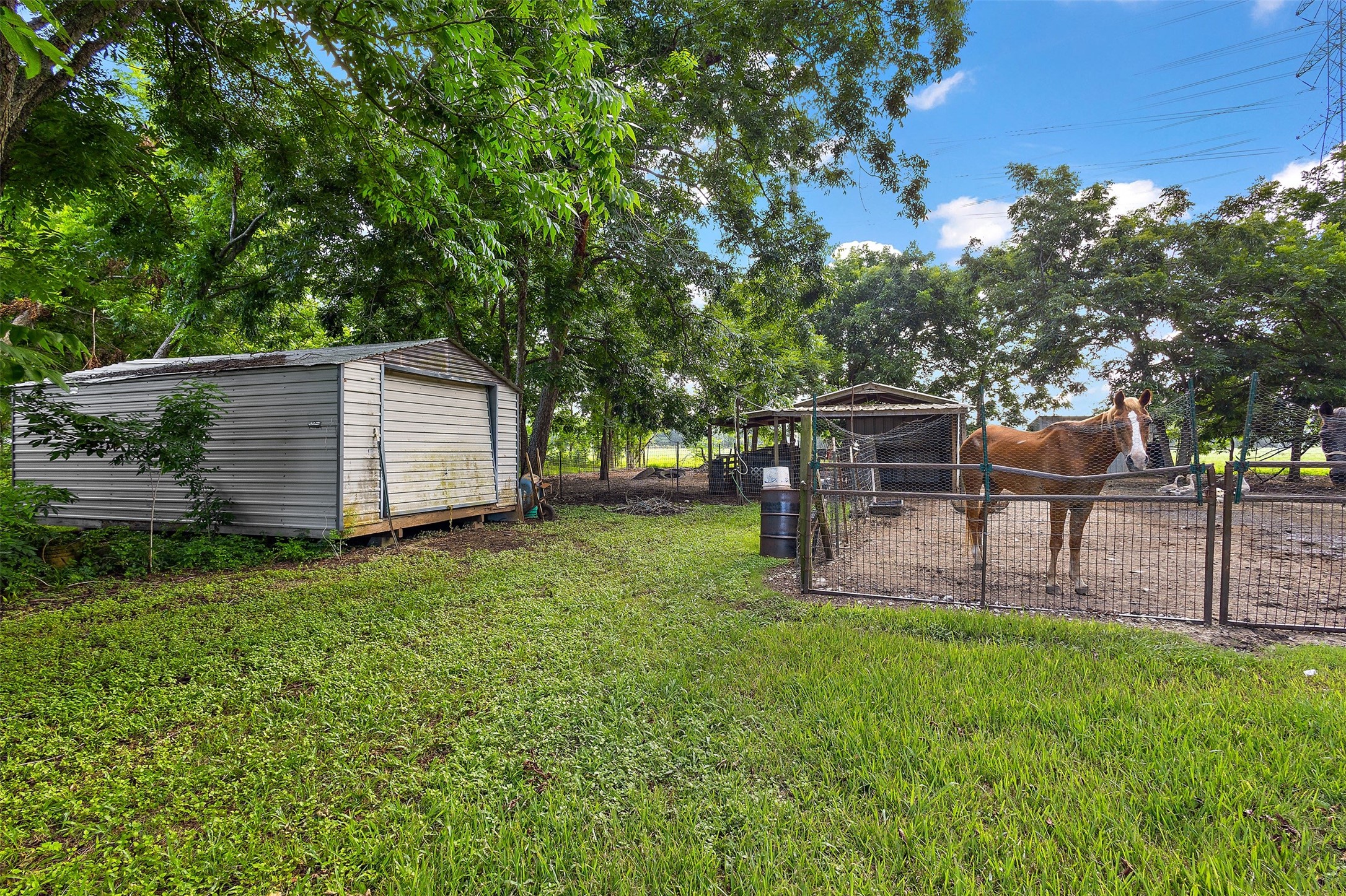 625 Pittman Road Richmond, TX 77469 - Photo 41 of 41 Spacious farm storage bulding for feed, hay,tack, and equipment, conveniently located next to horse-ready paddock. Horses are not included in the sale but may be available for separate purchase through negotiation with the seller.