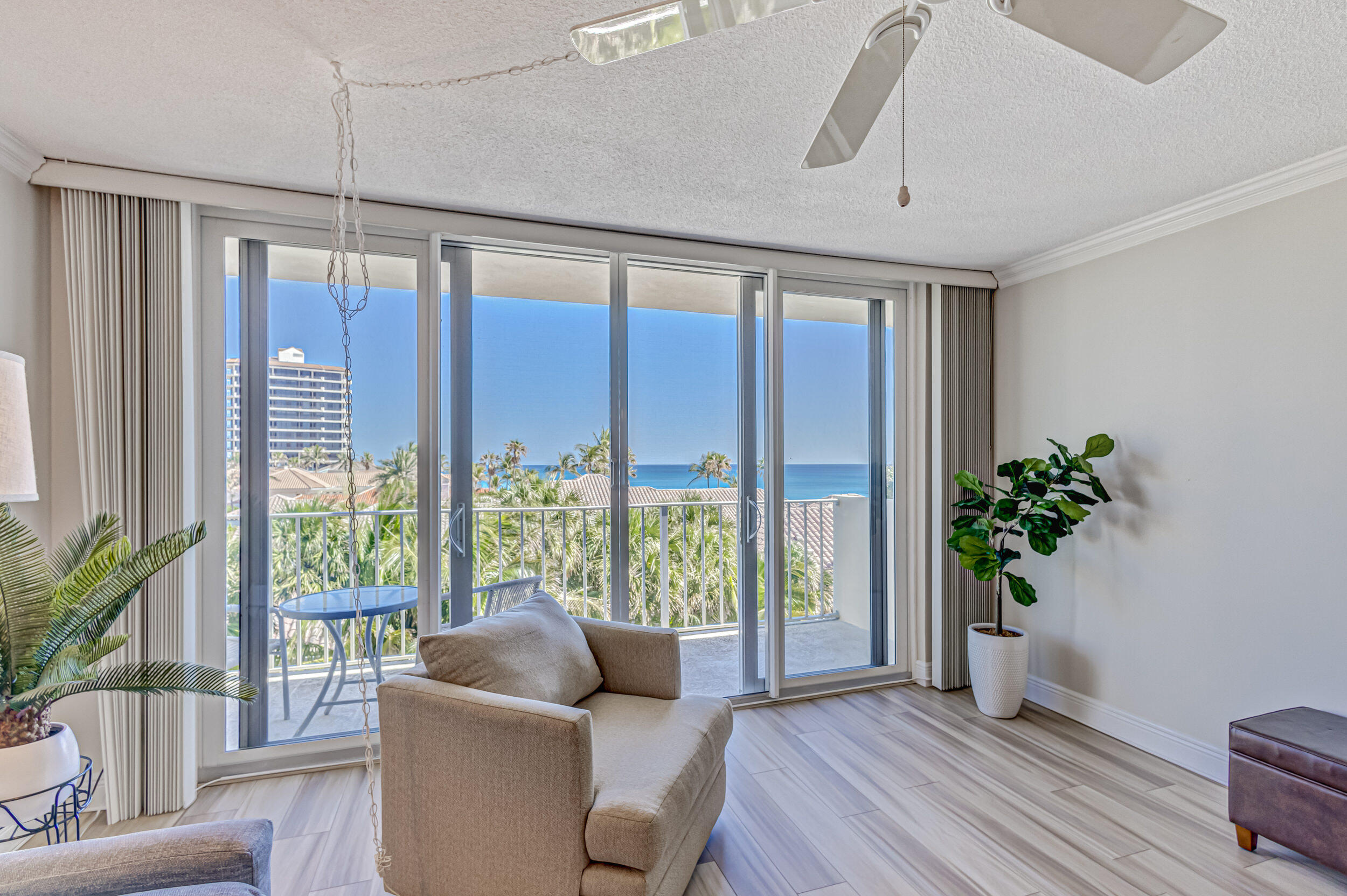 630 Ocean Drive, Unit 505 Juno Beach, FL 33408 - Photo 14 of 49 a living room with furniture and a potted plant