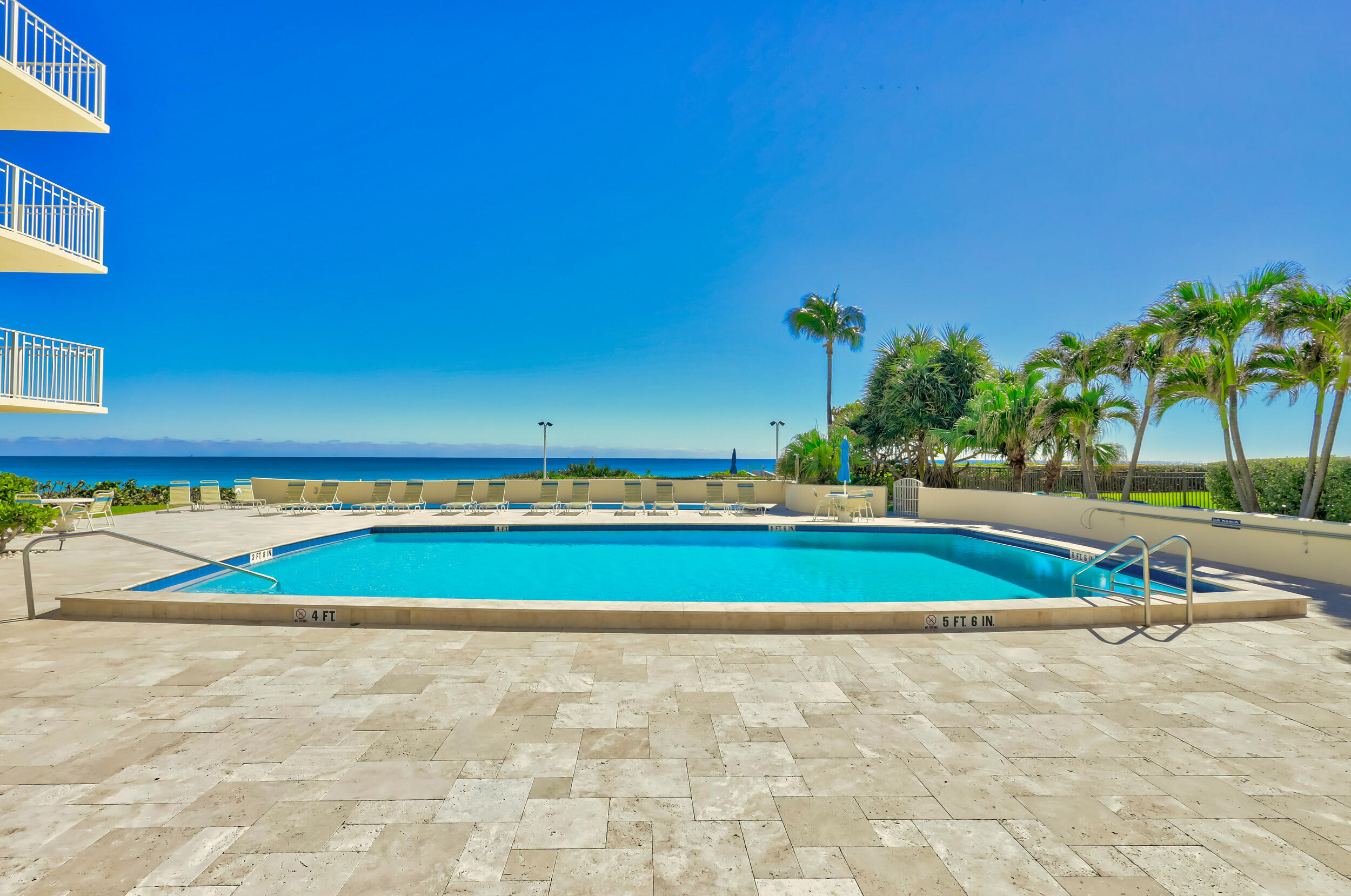 630 Ocean Drive, Unit 505 Juno Beach, FL 33408 - Photo 40 of 49 a view of swimming pool with outdoor space and seating area