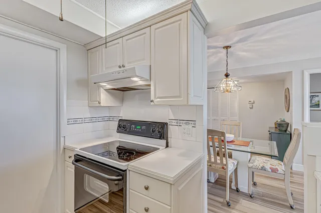 a kitchen with cabinets and appliances