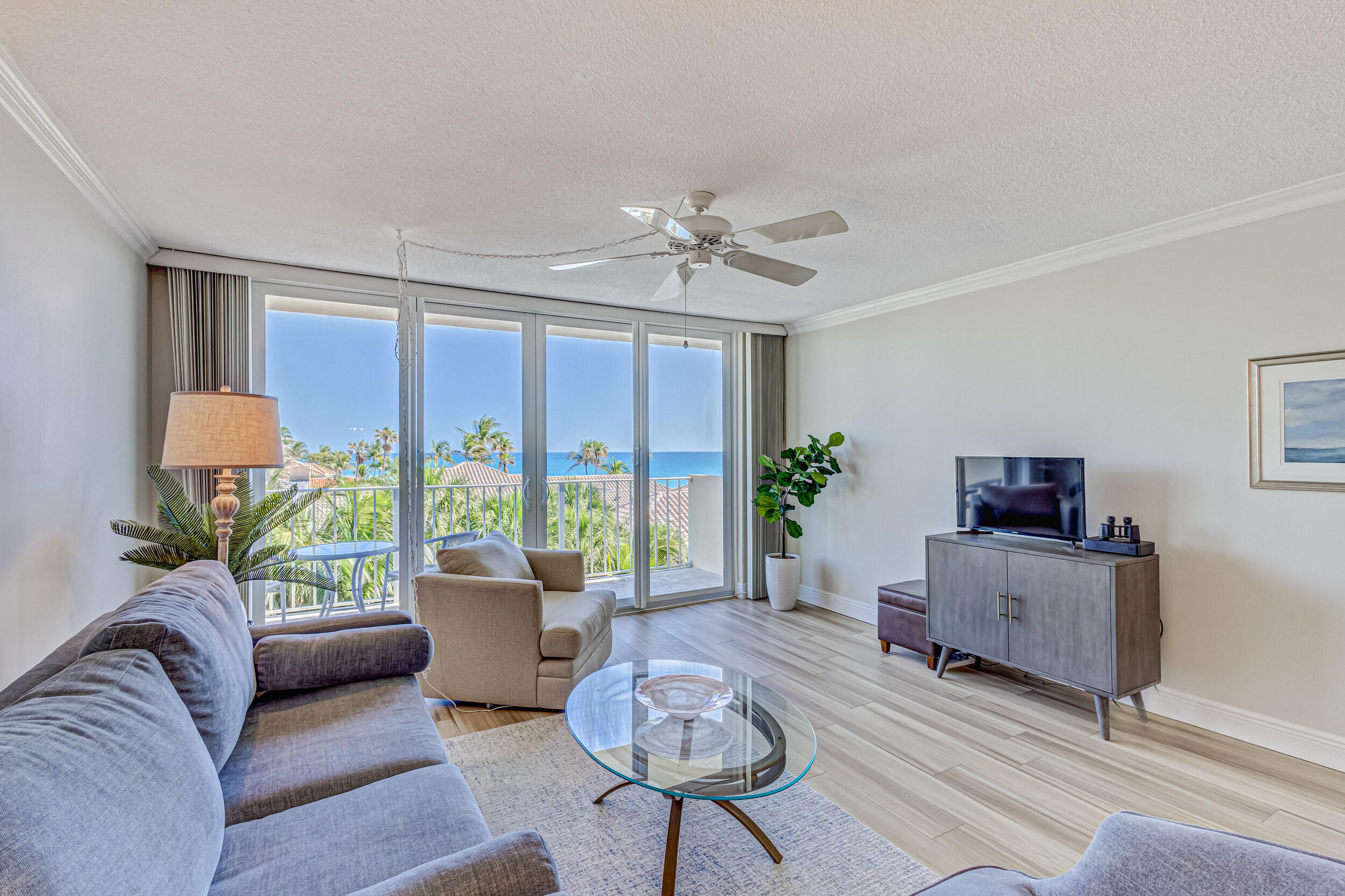 630 Ocean Drive, Unit 505 Juno Beach, FL 33408 - Photo 9 of 49 a living room with furniture and a large window