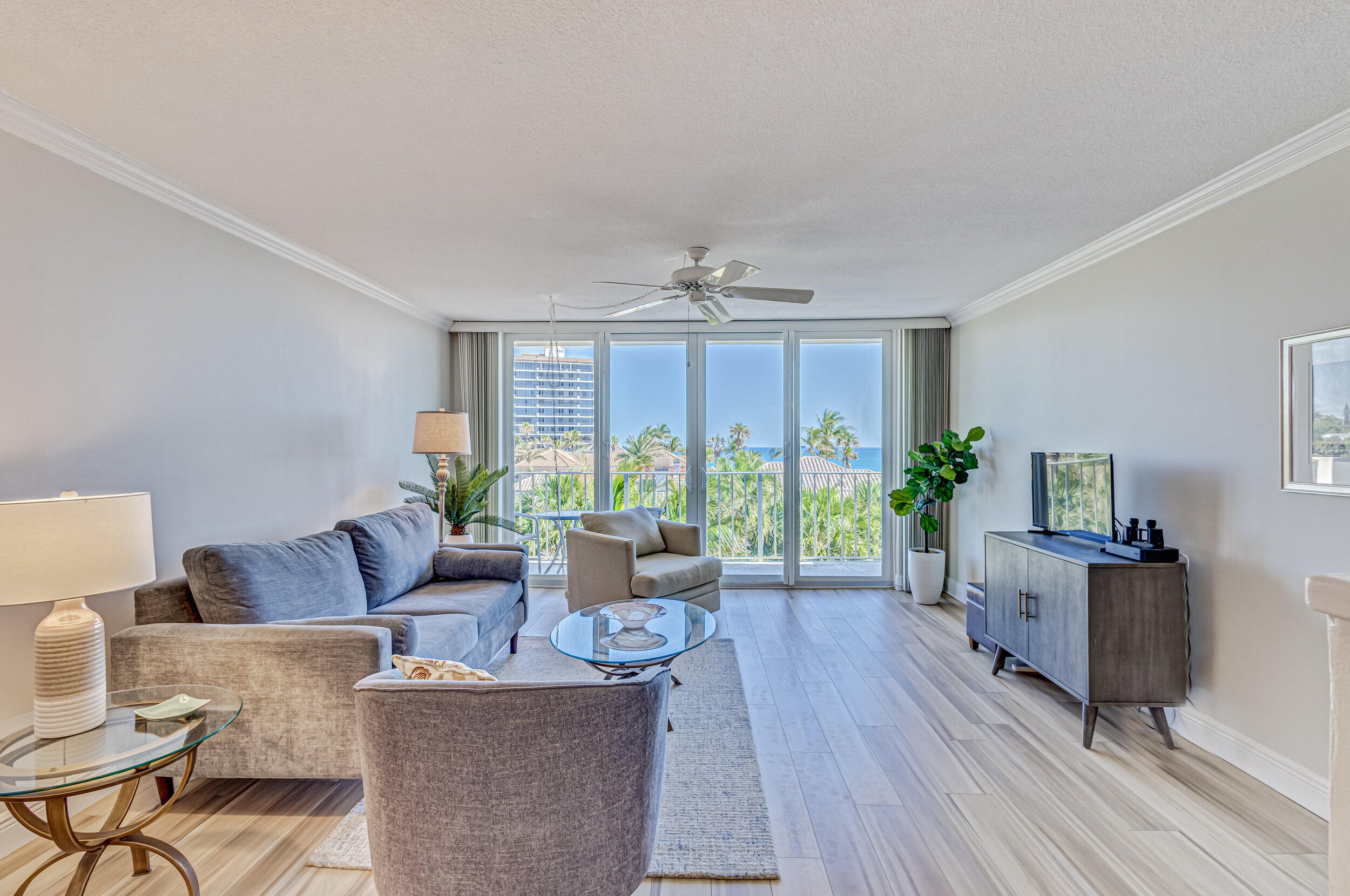 630 Ocean Drive, Unit 505 Juno Beach, FL 33408 - Photo 10 of 49 a living room with furniture and a large window