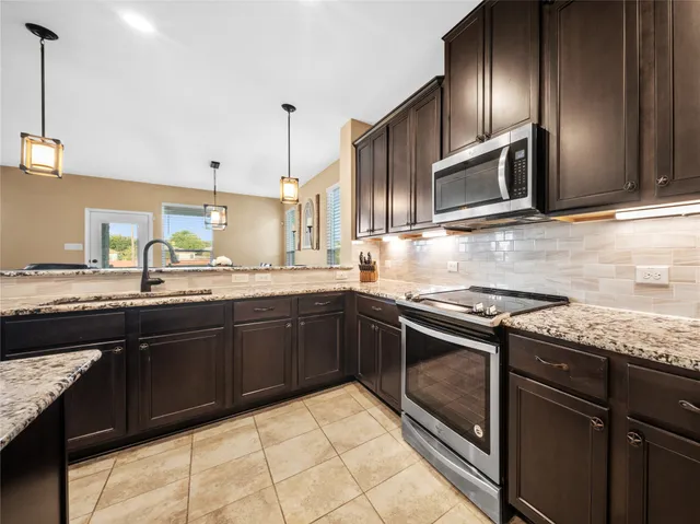 a bathroom with a double vanity sink toilet mirror and shower