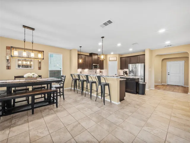 a dining room with furniture and window