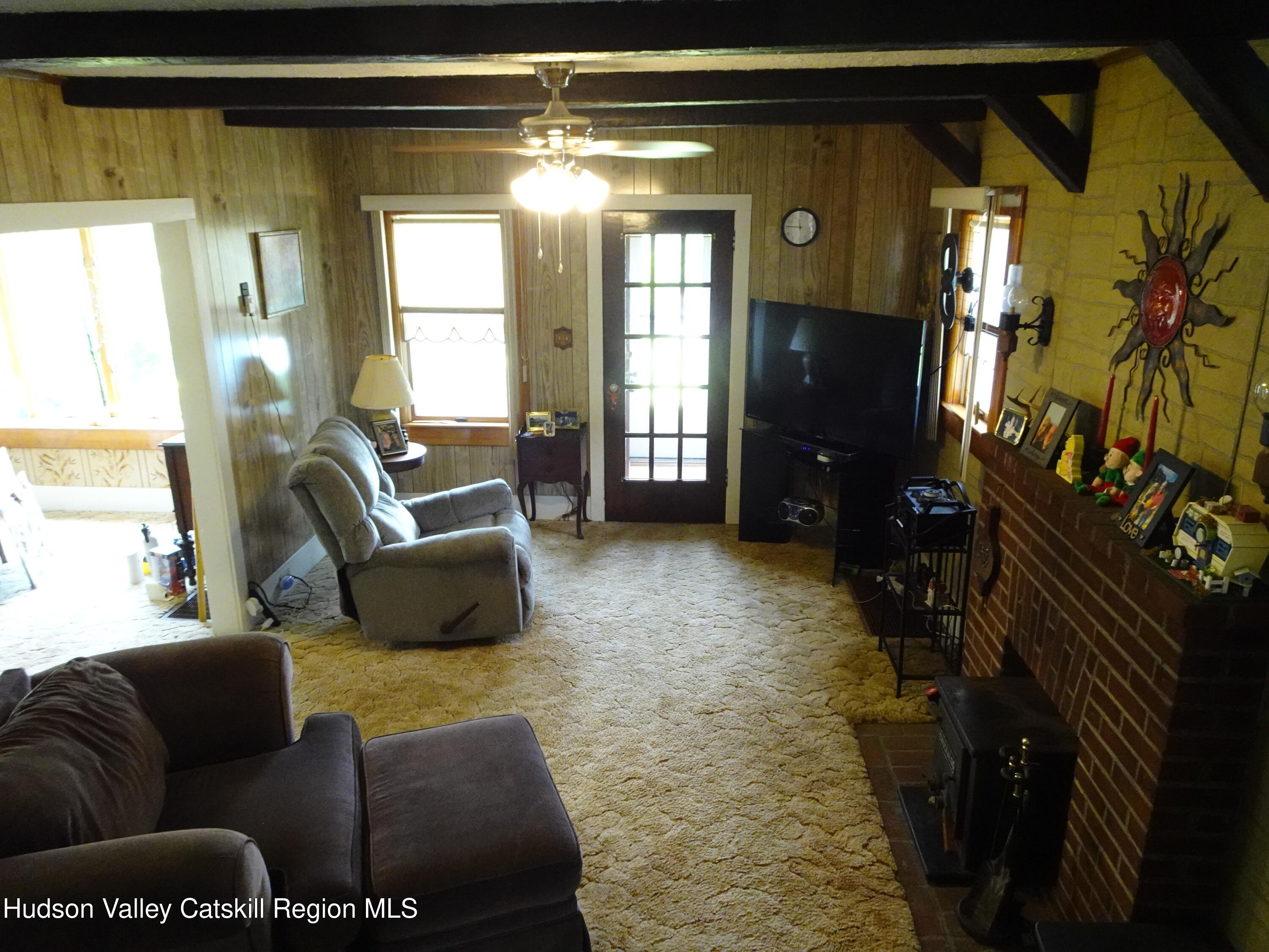 135 Millbrook Road Hudson, NY 12534 - Photo 14 of 40 a living room with furniture and a flat screen tv