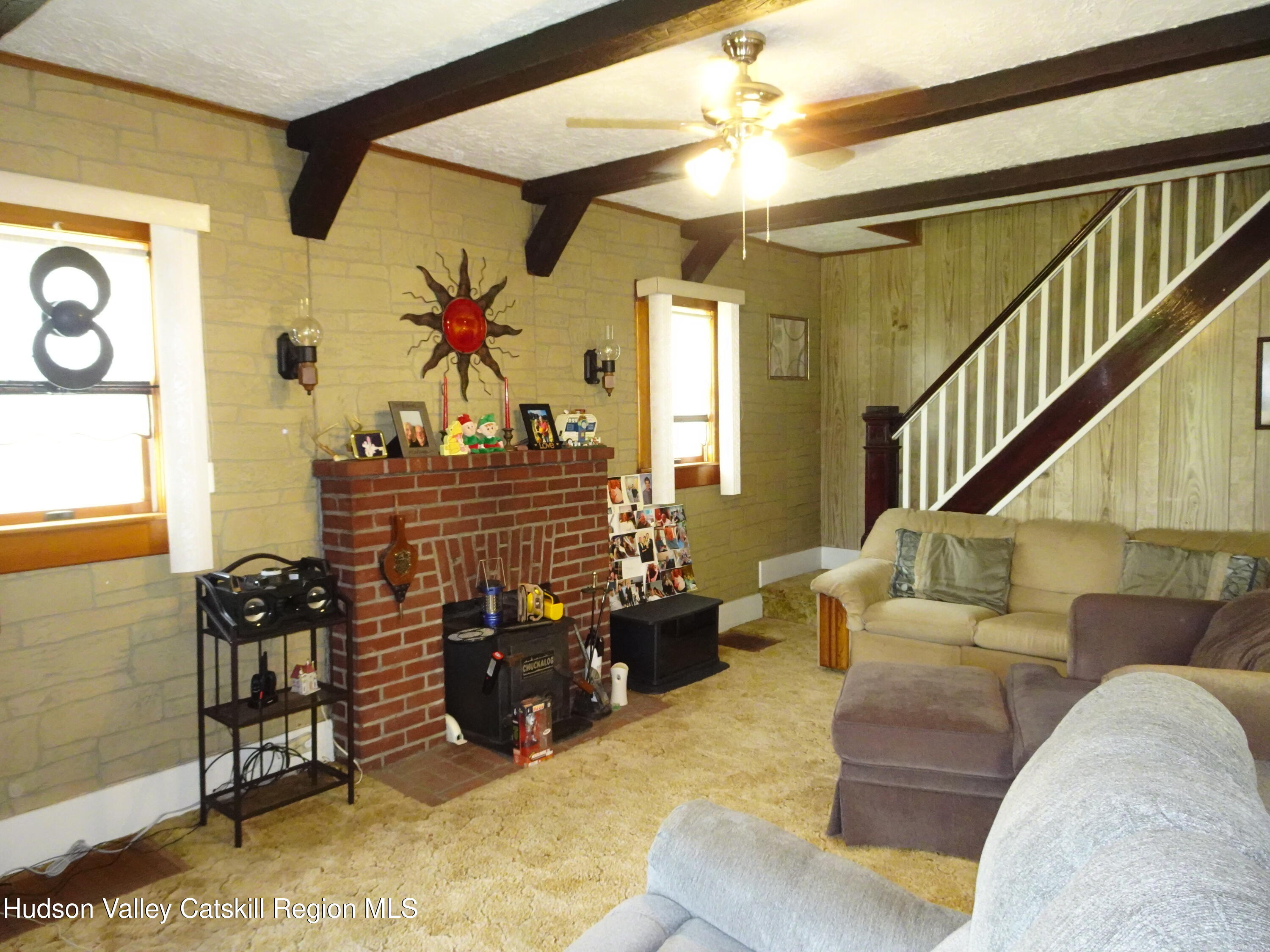 135 Millbrook Road Hudson, NY 12534 - Photo 17 of 40 a living room with furniture flowerpot and wooden floor
