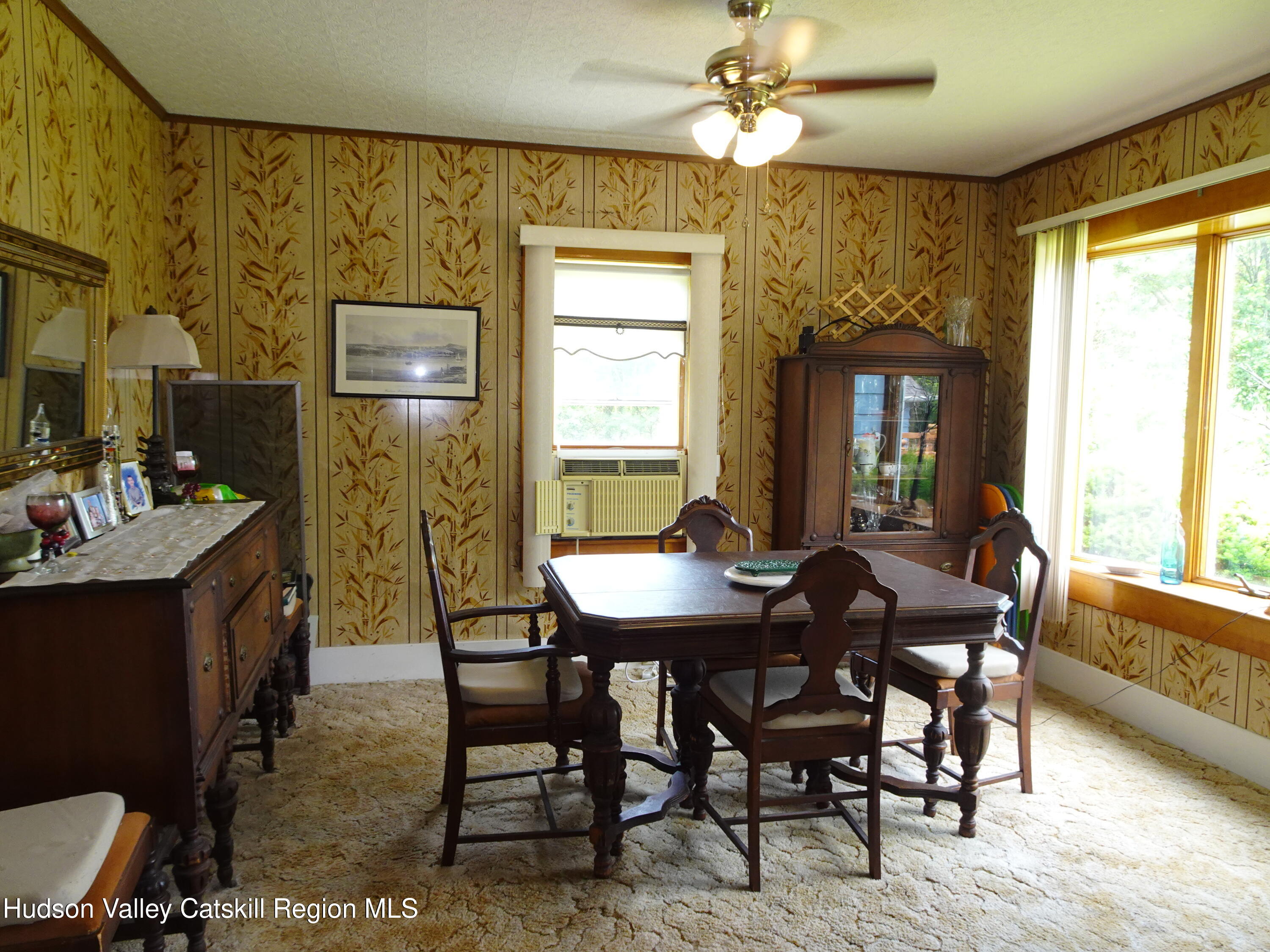 135 Millbrook Road Hudson, NY 12534 - Photo 18 of 40 a view of a dining room with furniture window and outside view