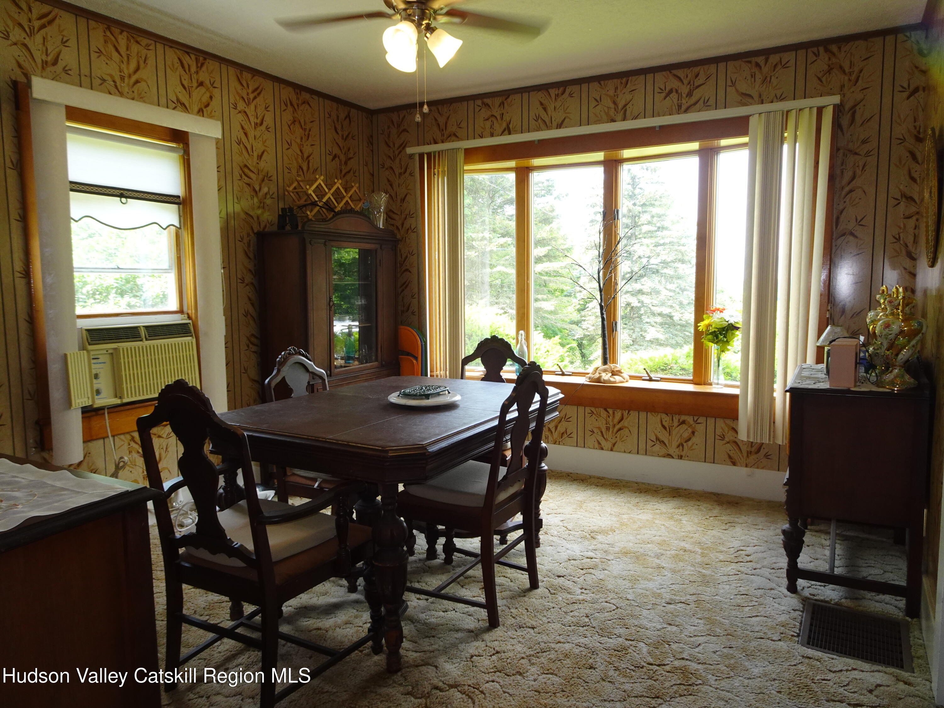 135 Millbrook Road Hudson, NY 12534 - Photo 19 of 40 a view of a dining room with furniture window and outside view