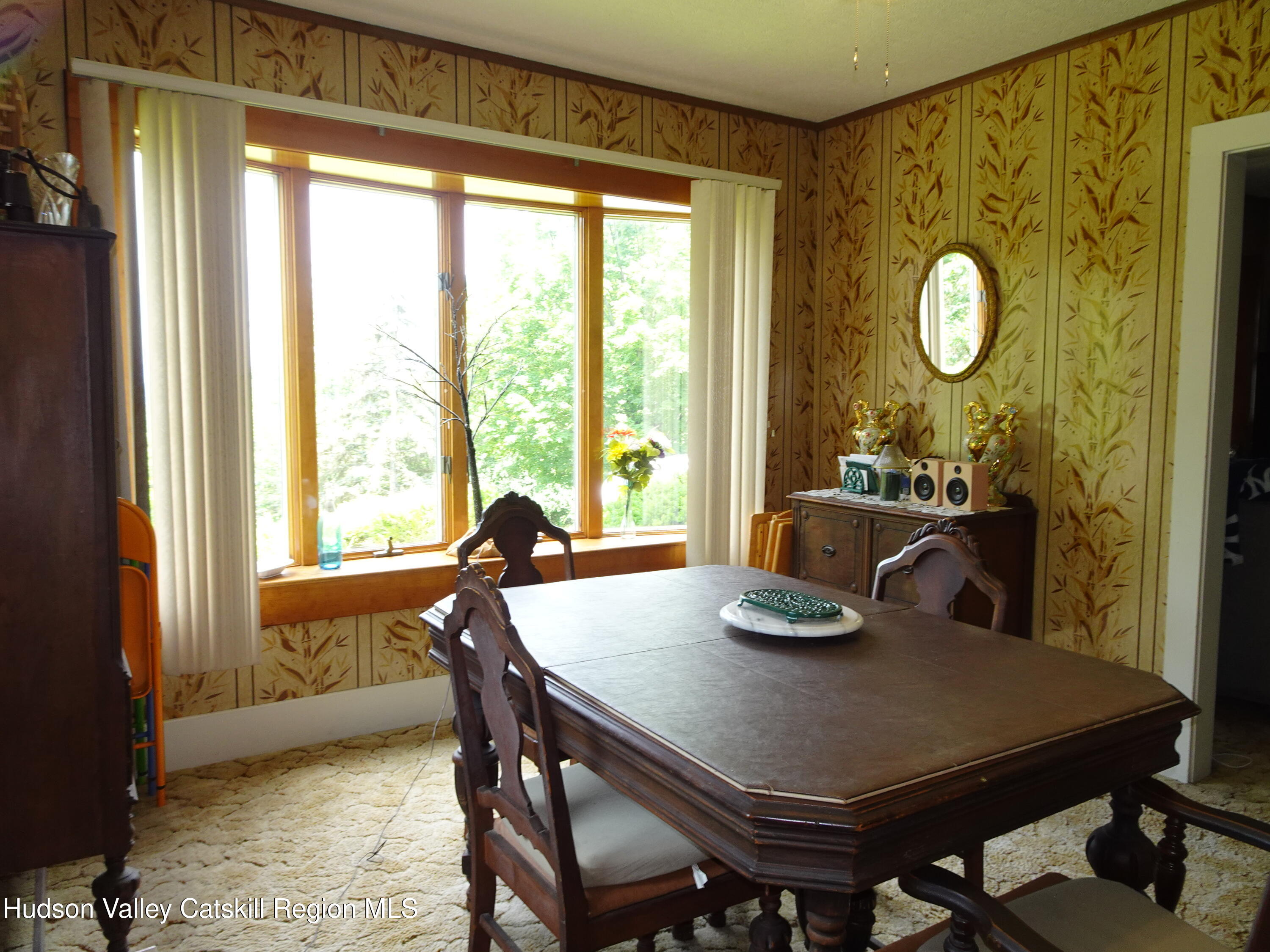 135 Millbrook Road Hudson, NY 12534 - Photo 20 of 40 a view of a dining room with furniture and window