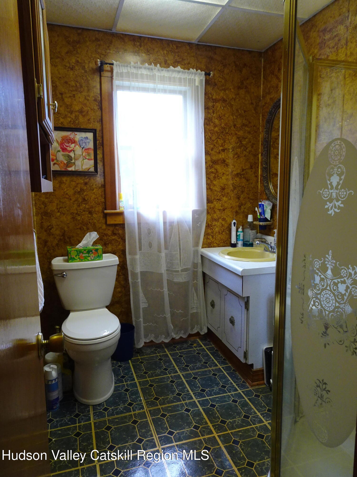 135 Millbrook Road Hudson, NY 12534 - Photo 23 of 40 a bathroom with a toilet sink and mirror