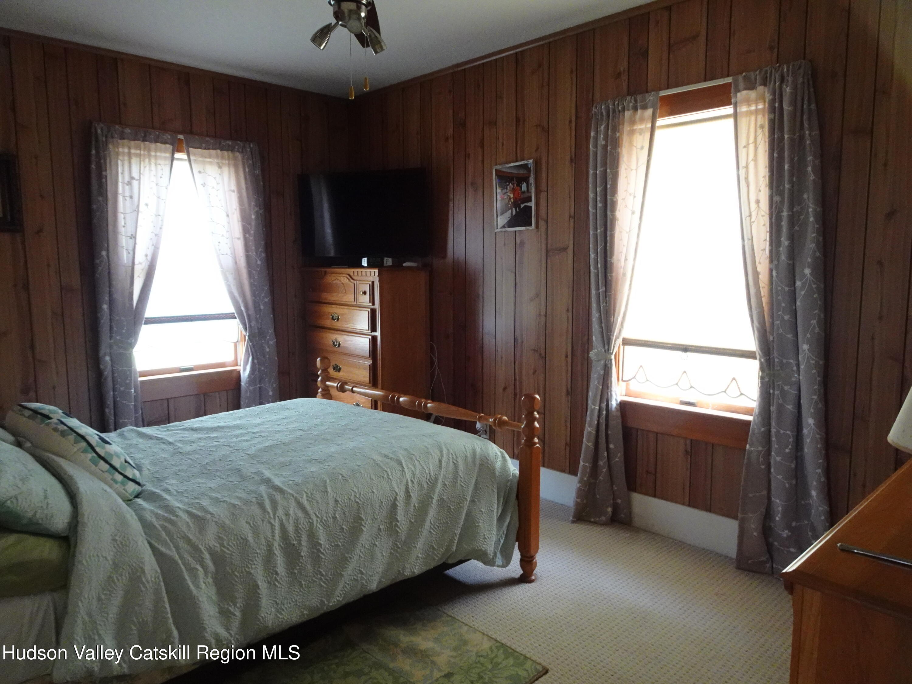 135 Millbrook Road Hudson, NY 12534 - Photo 26 of 40 a bedroom with a bed and a window
