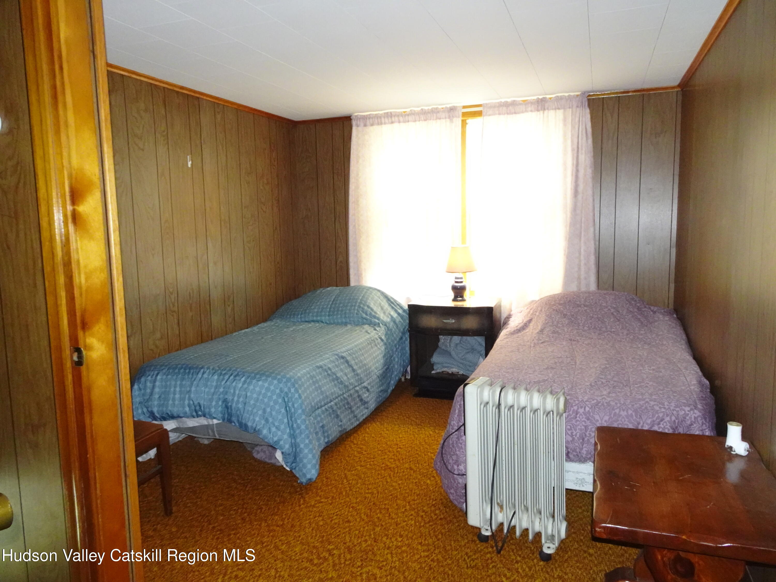135 Millbrook Road Hudson, NY 12534 - Photo 28 of 40 a bedroom with bed and window