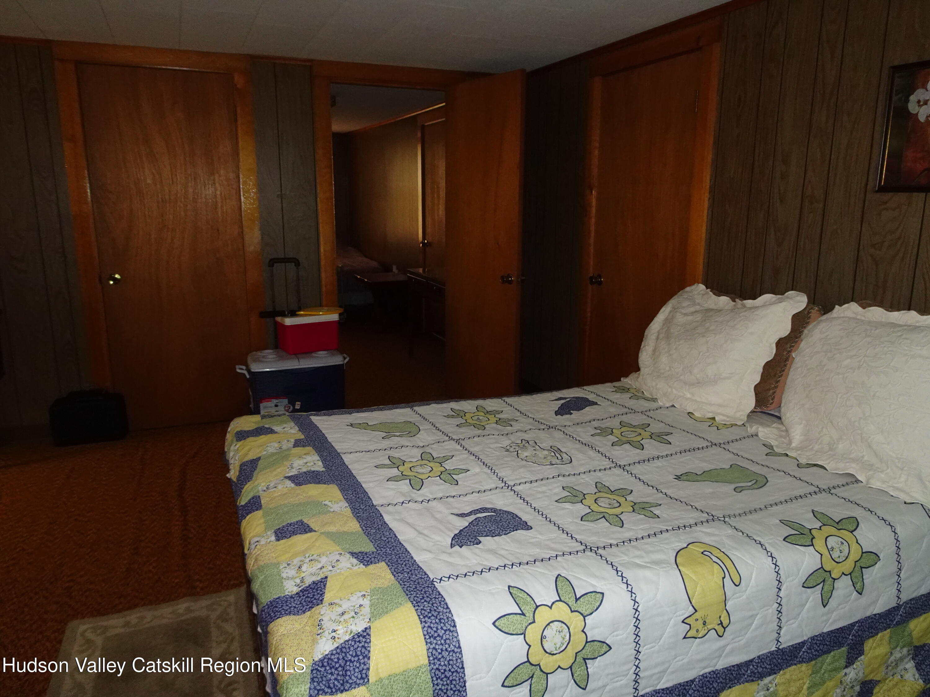 135 Millbrook Road Hudson, NY 12534 - Photo 32 of 40 a bedroom with a bed and a table in it