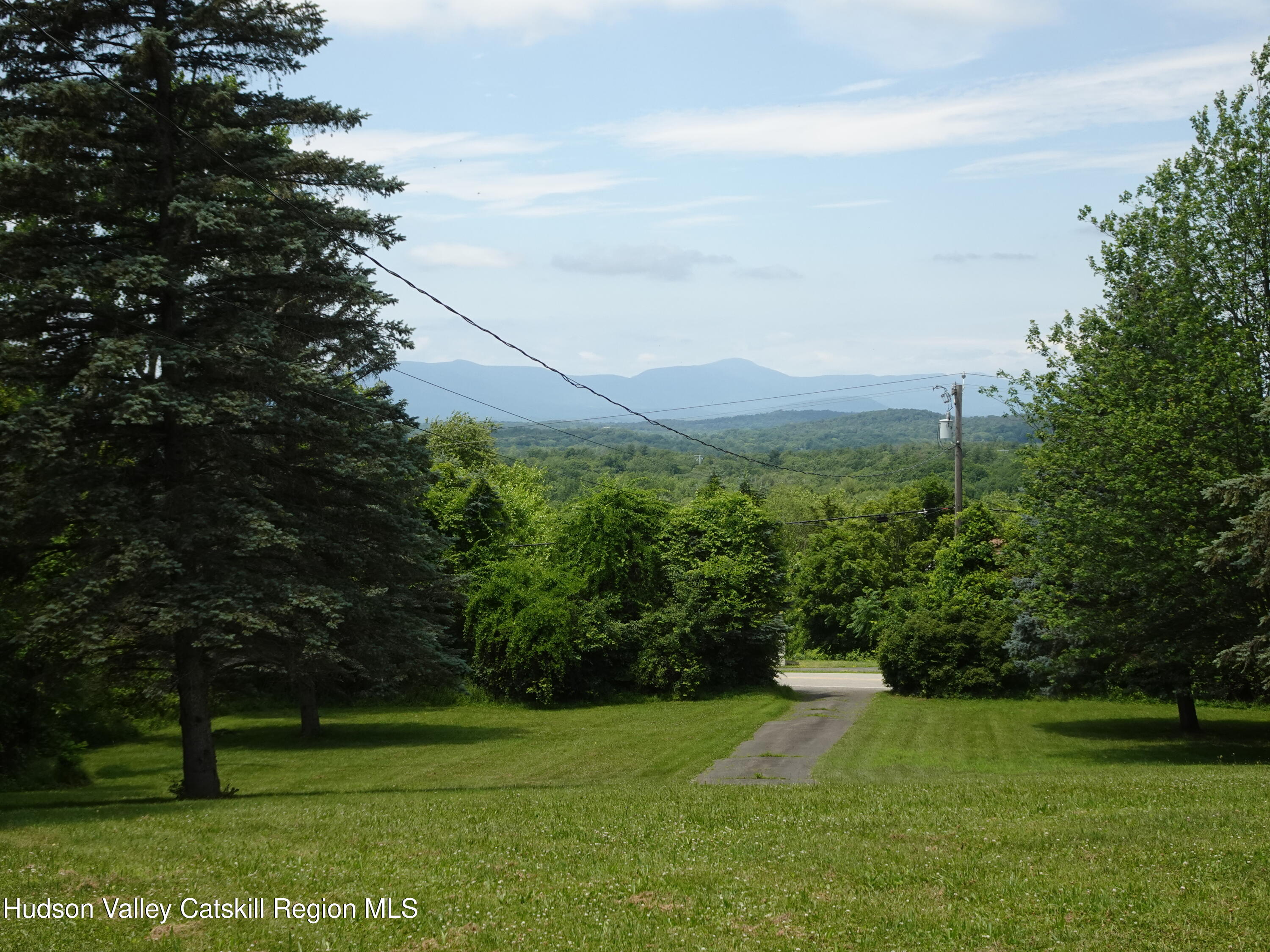 135 Millbrook Road Hudson, NY 12534 - Photo 33 of 40 a view of a field with a tree in the background
