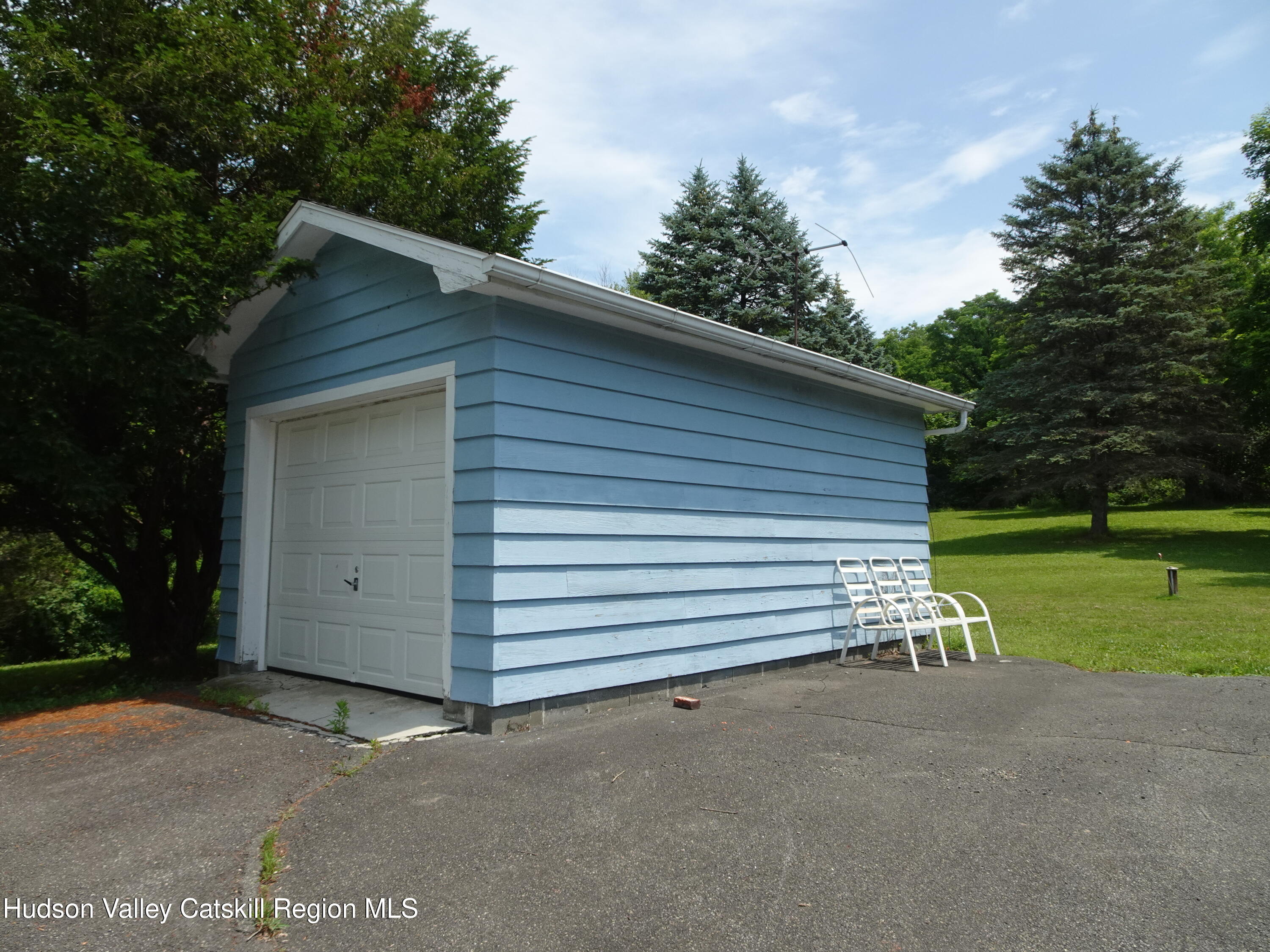 135 Millbrook Road Hudson, NY 12534 - Photo 36 of 40 a view of a house with a yard and garage