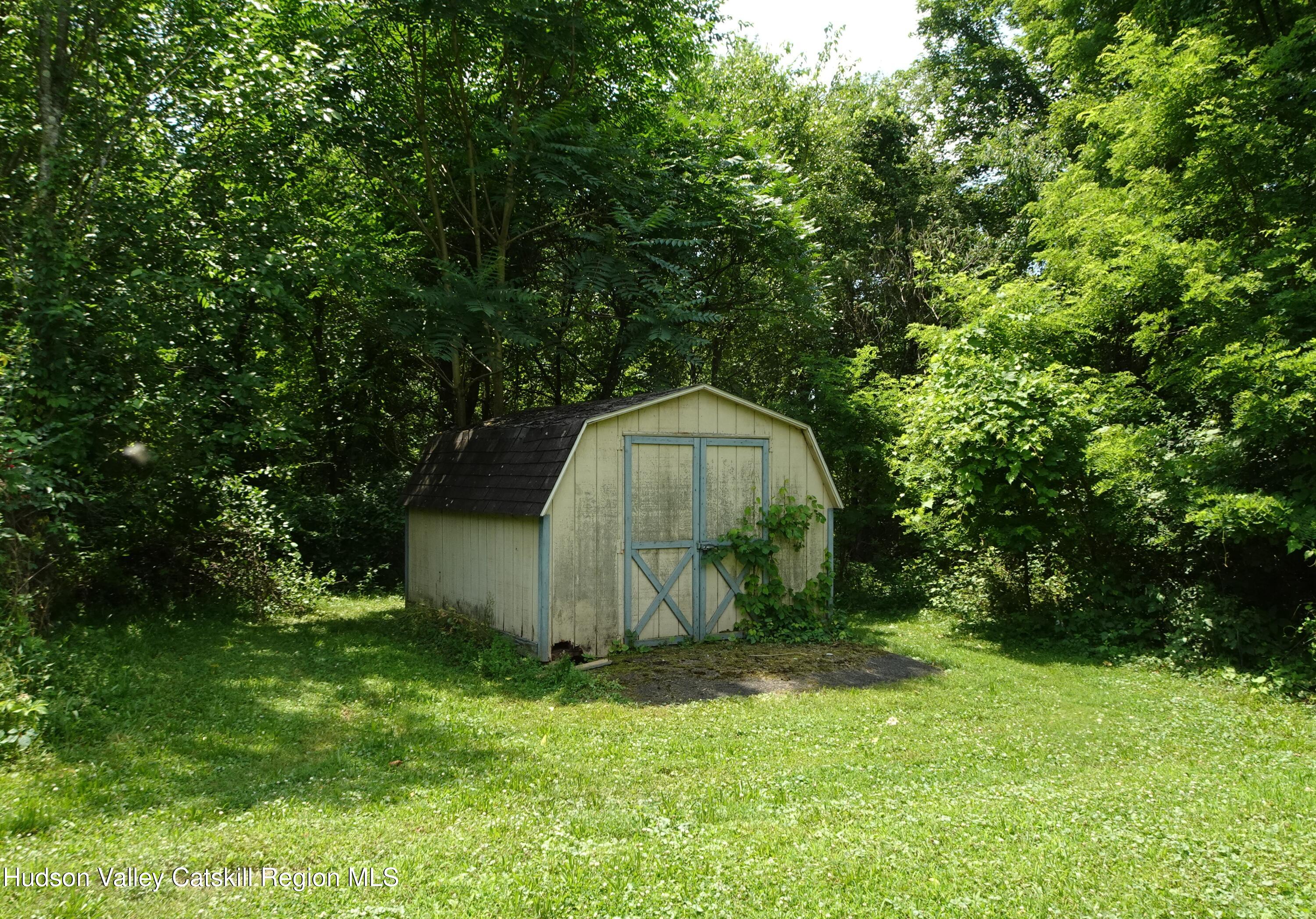 135 Millbrook Road Hudson, NY 12534 - Photo 39 of 40 a backyard of a house with lots of green space