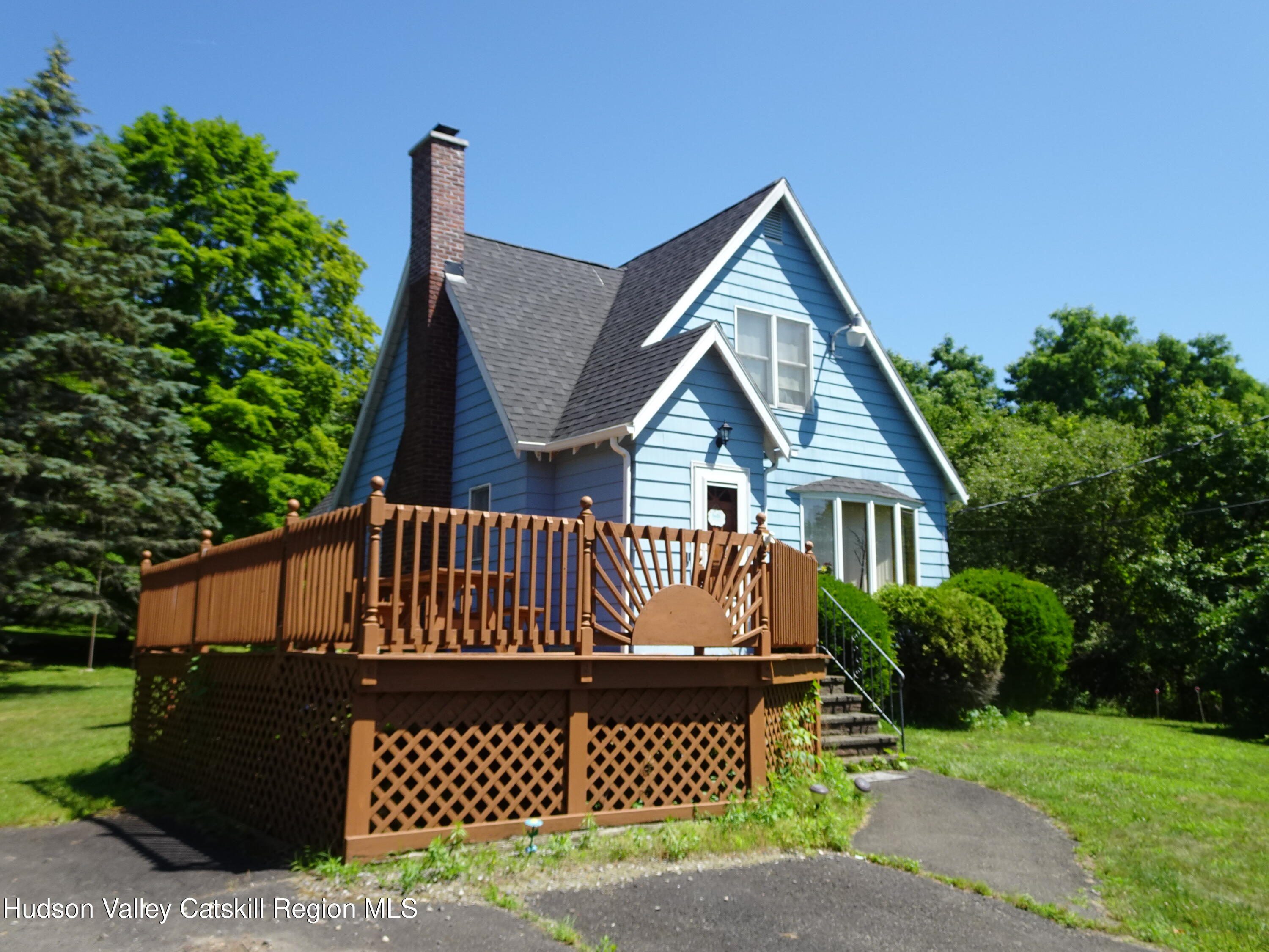 135 Millbrook Road Hudson, NY 12534 - Photo 4 of 40 a front view of a house with a yard
