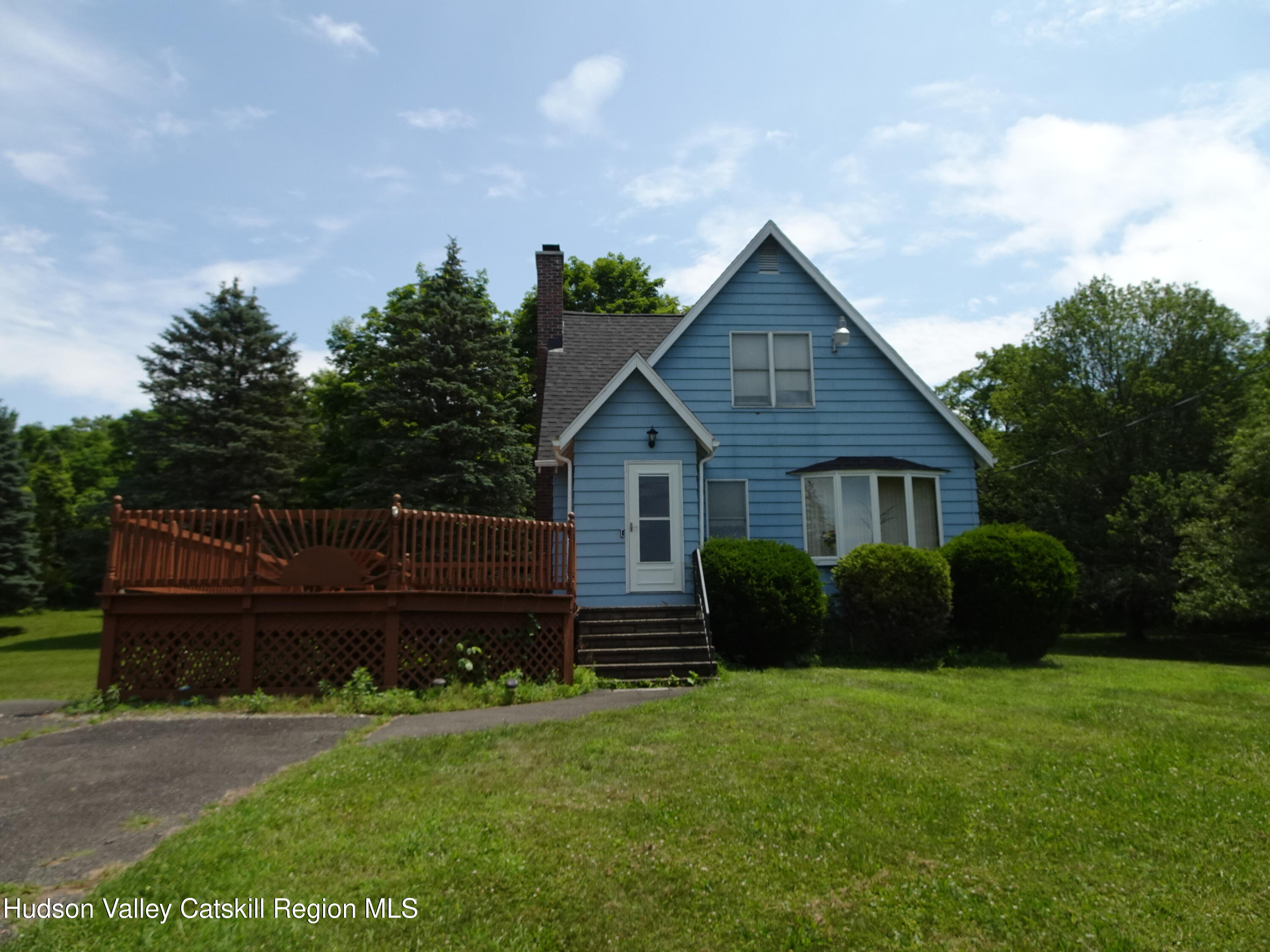 135 Millbrook Road Hudson, NY 12534 - Photo 5 of 40 a front view of a house with a yard