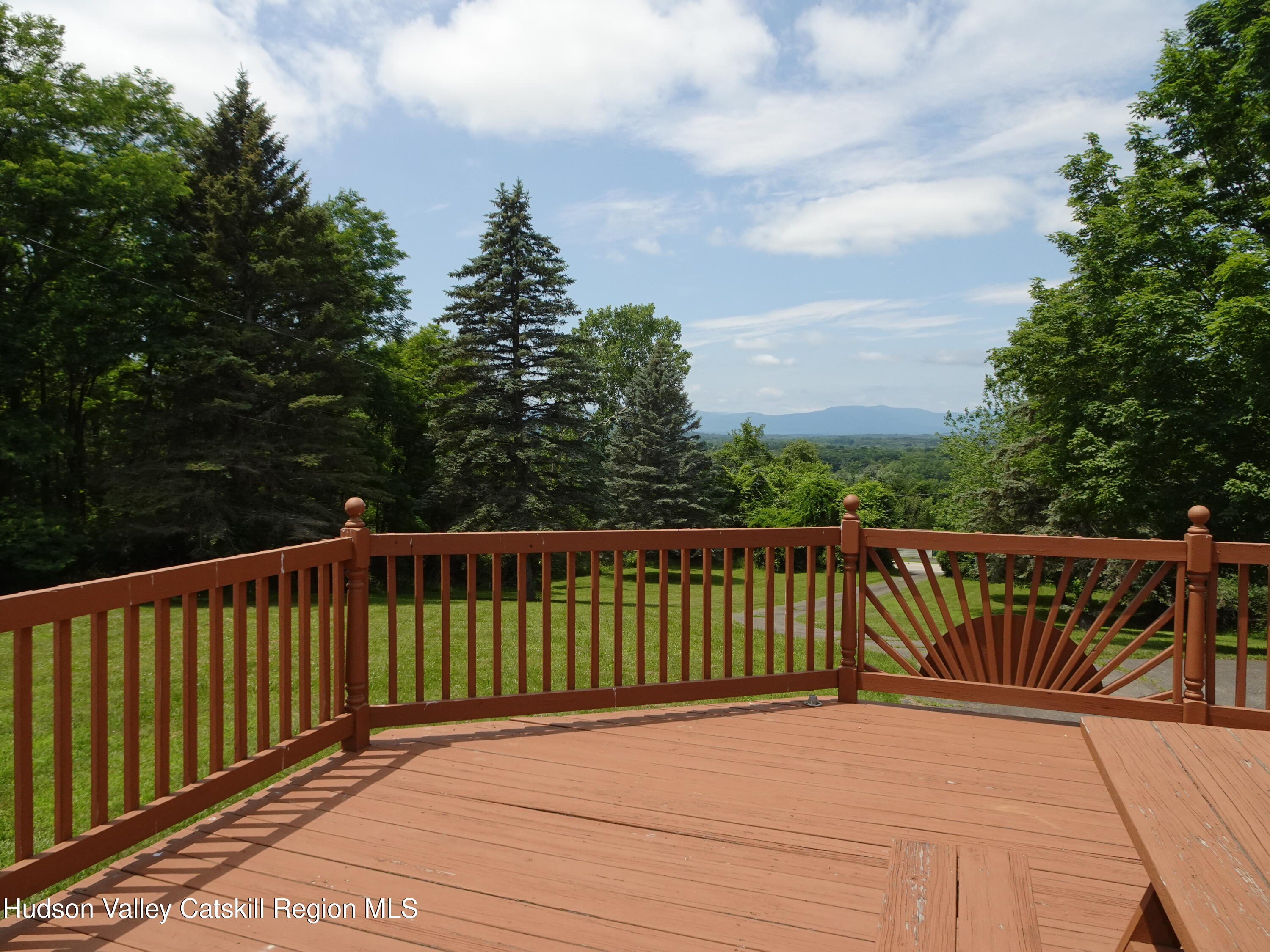 135 Millbrook Road Hudson, NY 12534 - Photo 6 of 40 a view of balcony with wooden floor and fence