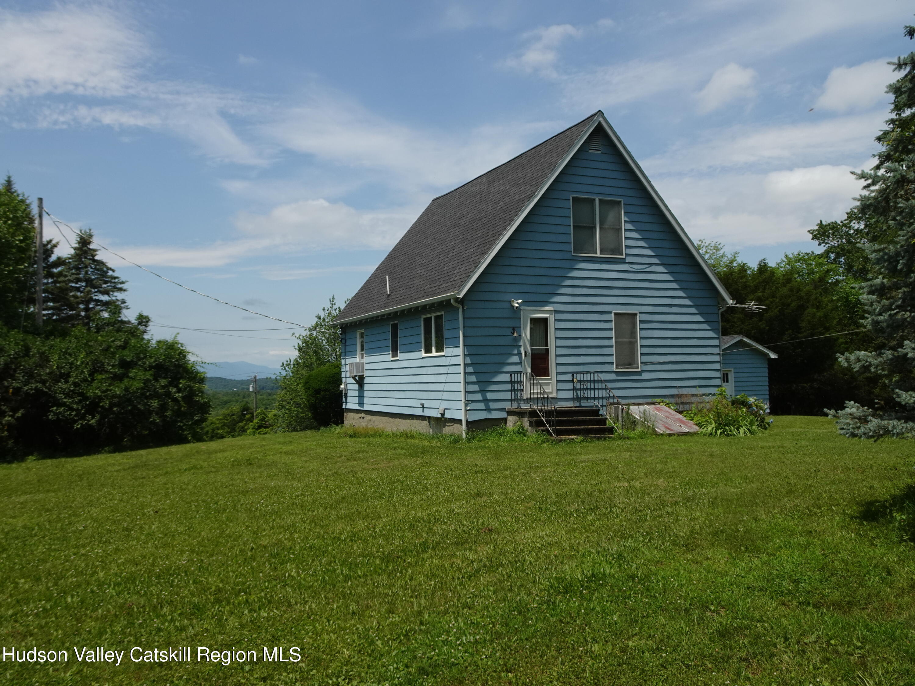 135 Millbrook Road Hudson, NY 12534 - Photo 8 of 40 a front view of a house with a yard