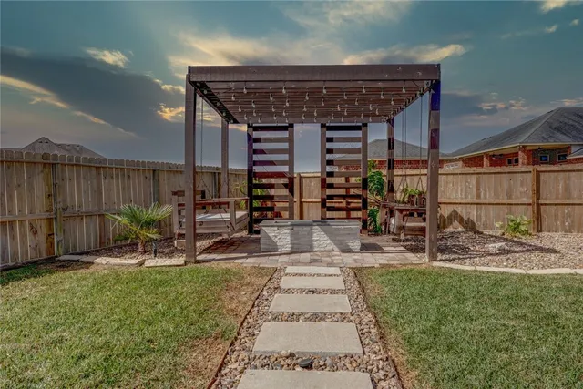 a front view of house with yard and trees