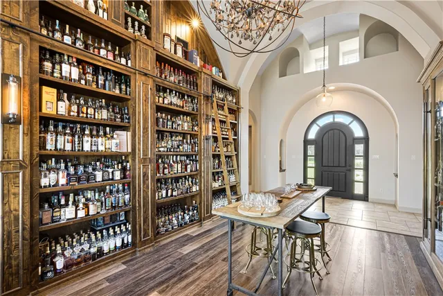 a view of a workspace with furniture window and wooden floor