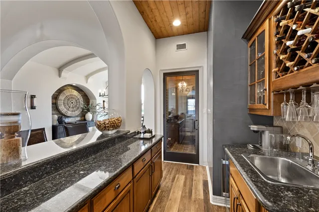 a kitchen with a sink and a stove top oven