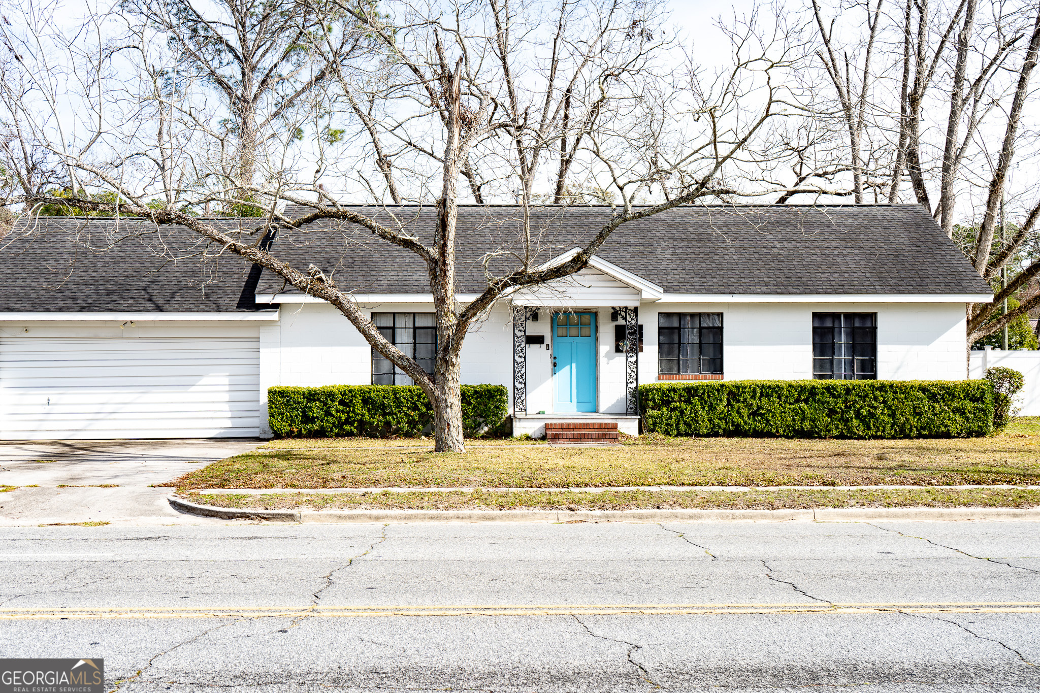 front view of a house with a small yard