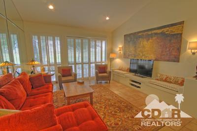 31 Medina Way Rancho Mirage, CA 92270 - Photo 2 of 25 a living room with furniture and a flat screen tv