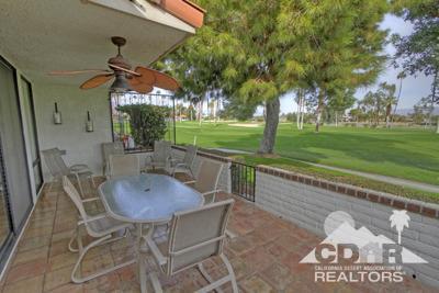 31 Medina Way Rancho Mirage, CA 92270 - Photo 12 of 25 a view of a patio with a table chairs and a backyard
