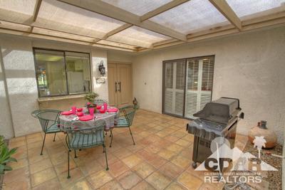 31 Medina Way Rancho Mirage, CA 92270 - Photo 20 of 25 a view of a dining room with furniture and chandelier