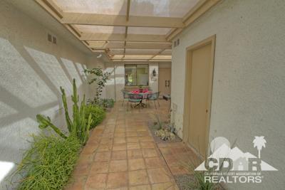 31 Medina Way Rancho Mirage, CA 92270 - Photo 21 of 25 a view of a entryway door of the house