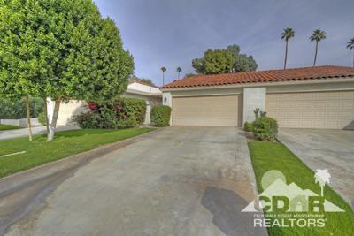 31 Medina Way Rancho Mirage, CA 92270 - Photo 22 of 25 a front view of a house with a yard and garage