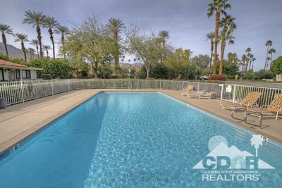 31 Medina Way Rancho Mirage, CA 92270 - Photo 23 of 25 a view of a swimming pool with a patio
