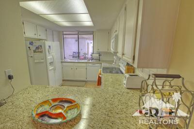 31 Medina Way Rancho Mirage, CA 92270 - Photo 7 of 25 a bathroom with a sink a mirror and shower