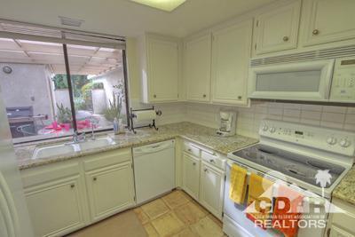 31 Medina Way Rancho Mirage, CA 92270 - Photo 8 of 25 a kitchen with sink and cabinets