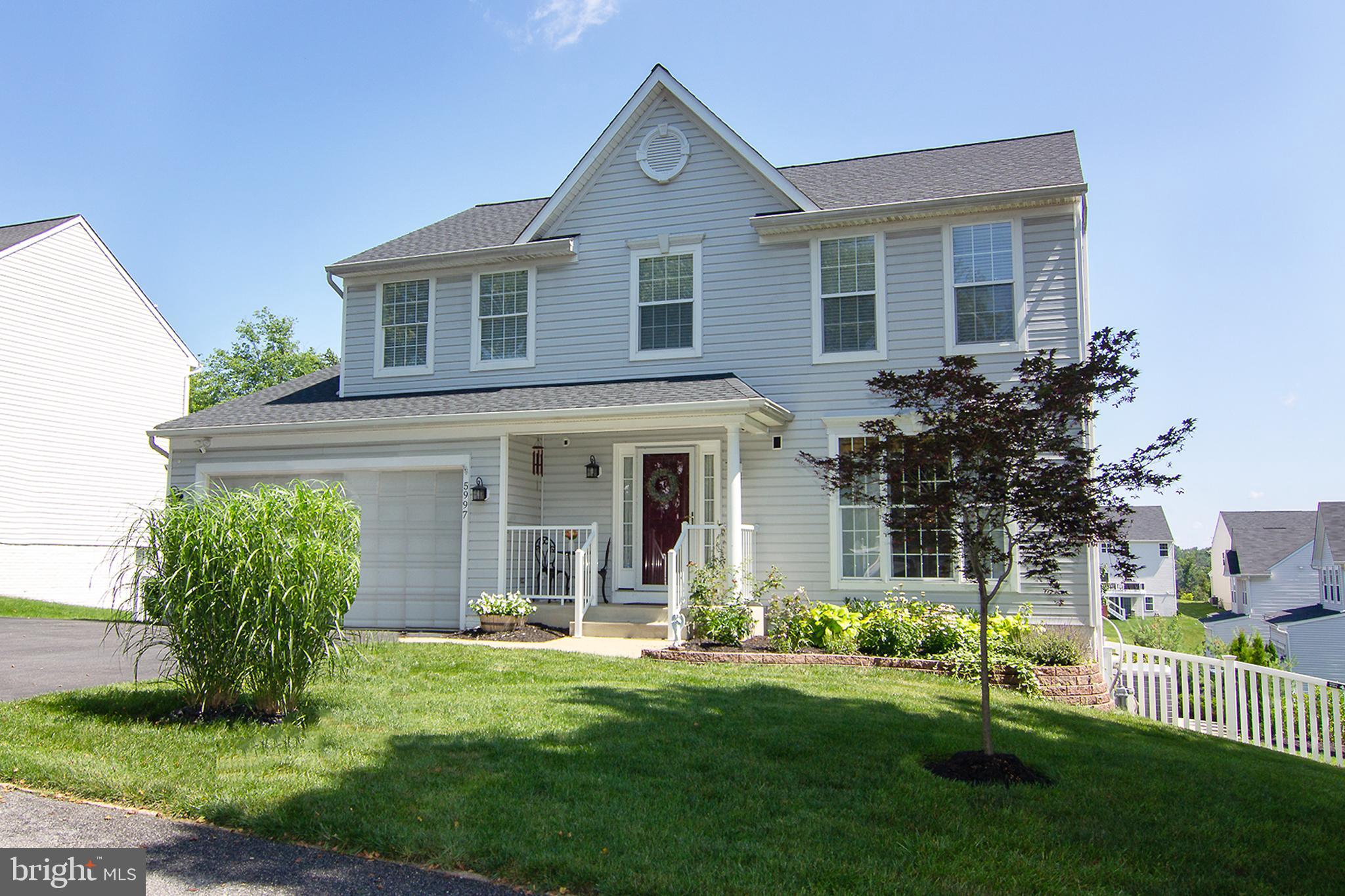 5997 Florey Road Hanover, MD 21076 - Photo 1 of 47 a front view of a house with a yard