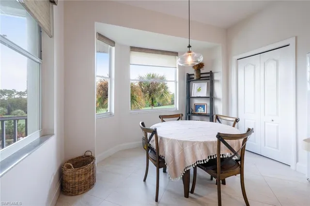 a dining room with furniture and window